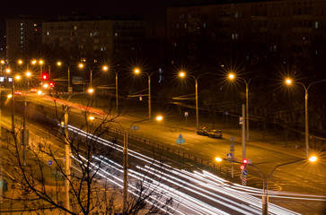 Fototapeta na wymiar night city, traces from headlights of cars.