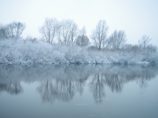 Winter river in the early misty morning