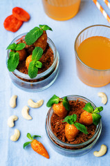 chocolate biscuit in a jar and dried apricots cashew candies in the form of carrots