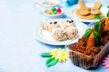 Easter background with sweets and juice for kid