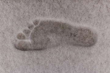 Bare foot print on the snow.