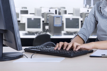 Female employee with computer in the office