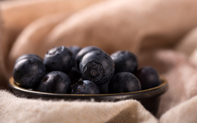 freshly picked blueberries in a bowl - concept for healthy eating