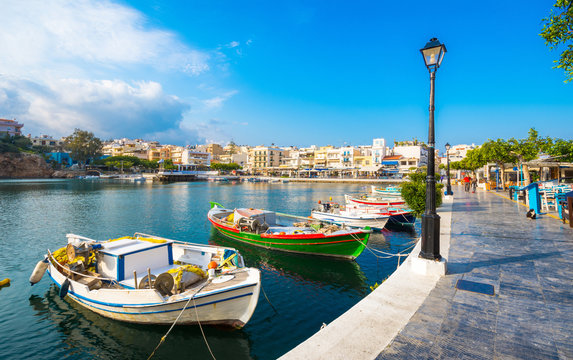 The lake Voulismeni in Agios Nikolaos,  a picturesque coastal town with colorful buildings around the port in the eastern part of the island Crete, Greece