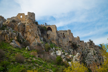 Fototapeta na wymiar The Saint Hilarion Castle lies on the Kyrenia mountain range, in Cyprus. This location provided the castle with command of the pass road from Kyrenia to Nicosia. Beautiful Castle in the Mountains.