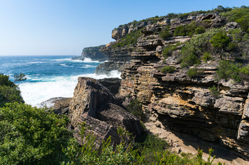Fototapeta na wymiar Rough cliff with rapid ocean waves landscape