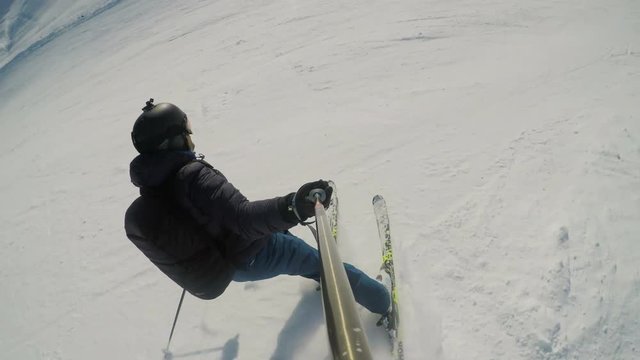 Fast ride going down, skier on track POV