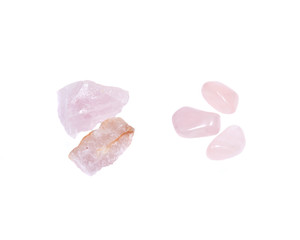 Rose quartz: chunks from Madagascar and tumbled from Brazil isolated on white background