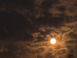 Sun in  The Full Gray Clouds