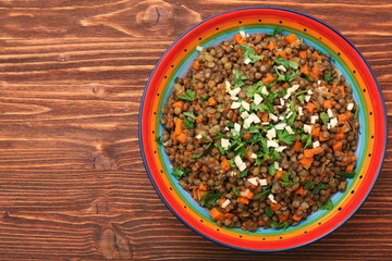 Lentil with carrot and onion in bowl