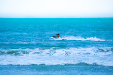 Two girls enjoying speedboat at the beach