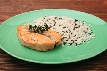 Salmon with wild rice on a plate