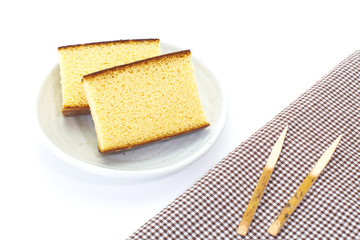 Sponge cake , a cake based on wheat flour , sugar, butter and eggs