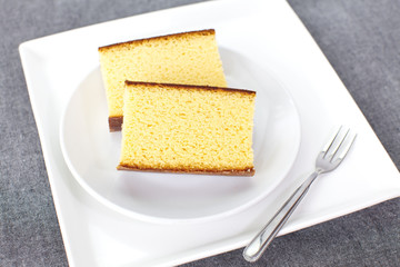 Sponge cake , a cake based on wheat flour , sugar, butter and eggs