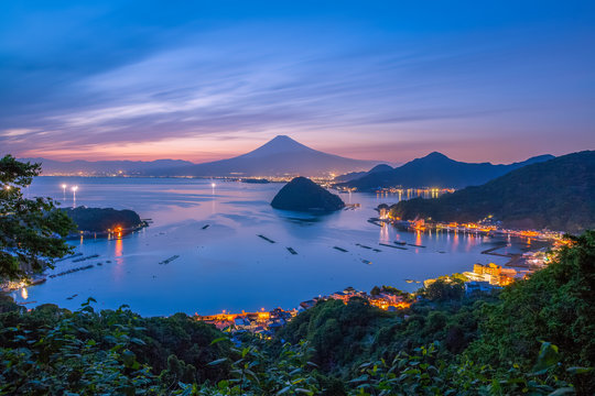 View of Mount Fuji with Suruga bay and Numazu town in twilight time