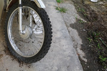 Close up wheel flat tire of the motorcycle old and cracked