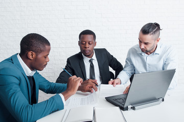 Fototapeta premium Financial team working with documents. Preparing new contracts for signing, making accounting paperwork.