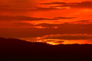 sunset in sky and cloud, beautiful colorful twilight time with mountain silhouette