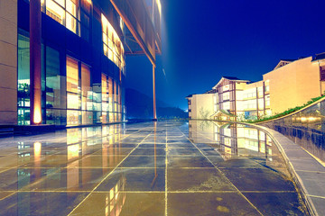 modern building with glass wall near pond
