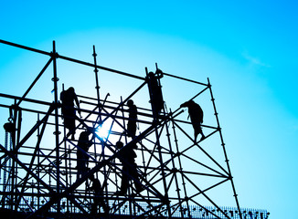 Construction workers working on scaffolding