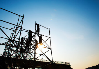 Construction workers working on scaffolding