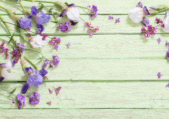 flowers on green wooden background