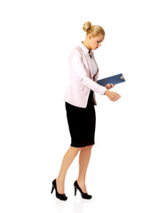 Thoughtful focused businesswoman reading her notes