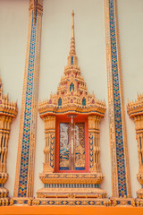 Ancient Thai temple. Wat Kosit Wihan golden Temple Phuket, Thailand. Decor architecture wall.