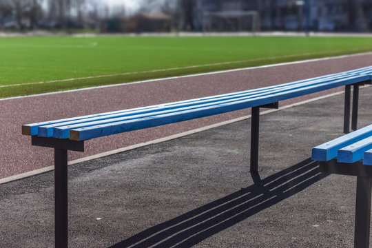 Wooden bench seats for fans on soccer football field