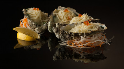 seafood and mussels in a shell with melted cheese and lemon slices on a black background with reflection. mussels in a shell with salad on a dark background