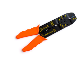 Modern dark office desktop computer, a mobile phone with a black screen on a laptop, and a Cup of tea. Top view with copy space, flat lay.