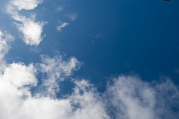 White clouds in the blue sky.