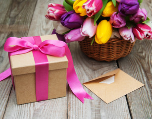 Spring tulips flowers and gift box