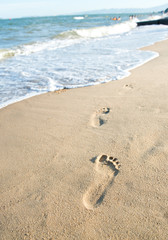 Footprints on the sand beach