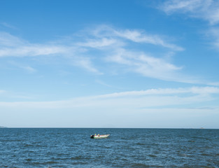 Fototapeta na wymiar Blue sea with white clouds for background.