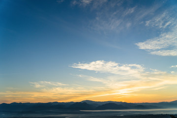 Fototapeta na wymiar Misty morning sky above the mountains.