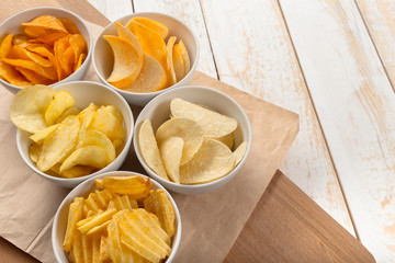 Pretzels in bowls on wooden table from above