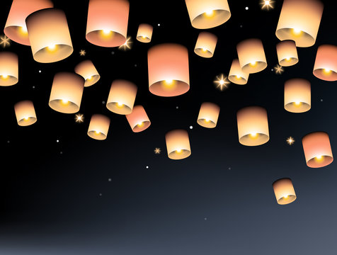 Sky lanterns floating in the air at night