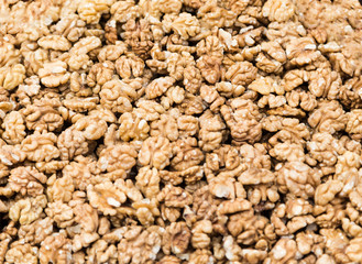 A handful of shelled walnuts in the market.