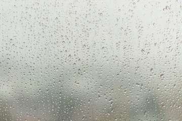 Rain caught at the window glass