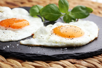 fried eggs with basil pepper and salt