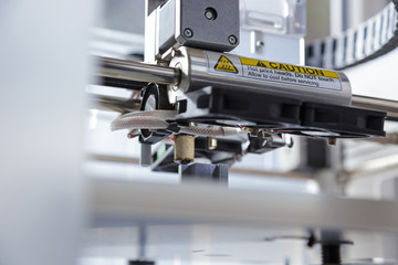 3d printer working and printing an object