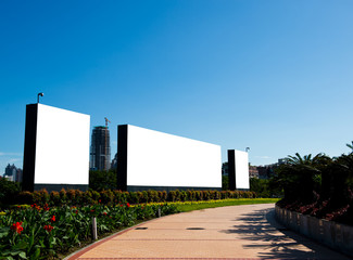 Blank billboard against blue sky.