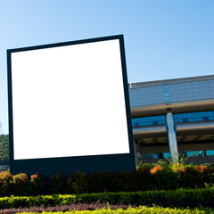 Blank billboard against blue sky.