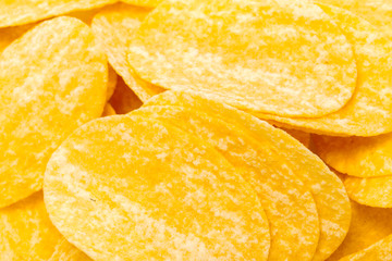 yellow potato chips isolated on white
