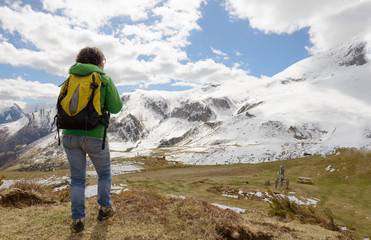 hiker in the Pyrenees mountains in spring with snow