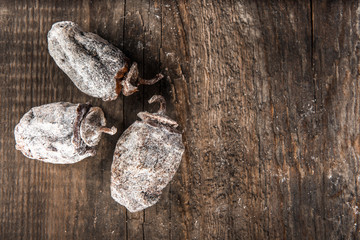 Dried persimmon on wooden background
