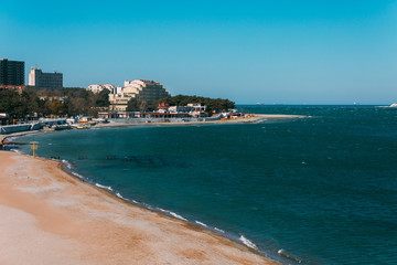 Fototapeta na wymiar View of the tip of Cape Tolstoy, desert beach, hotels and entertainment in Gelendzhik, Russia