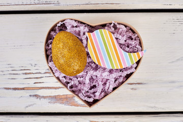 Box with sparkly Easter egg. Bright paper bird cutout. Special Easter present idea.