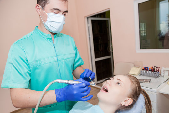 Woman at the dentist's chair during a dental procedure. 
